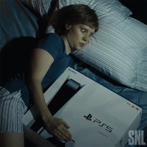 Woman Lying In Bed With PS5 Box GIF