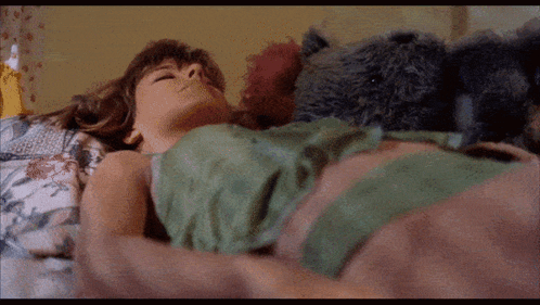 Woman Lying in Bed With Teddy Bear