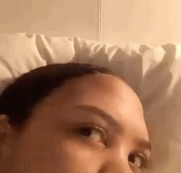 Woman Lying in Bed With White Pillow