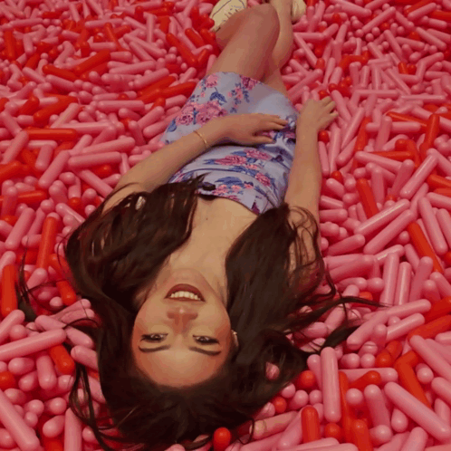 Woman Lying in Pink Sprinkles
