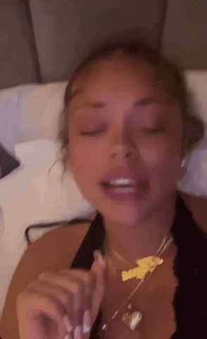 Woman Lying On Bed With Eyes Closed GIF