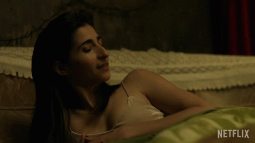 Woman Lying On Bed With Netflix GIF