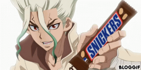 Woman Lying on Bed with Snickers Bar