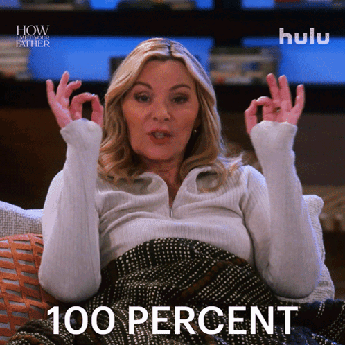 Woman Lying on Couch With Hands Up 100 Percent