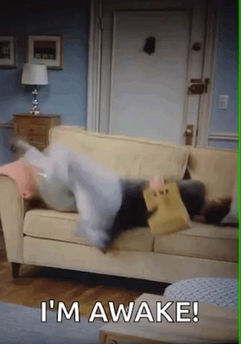 Woman Lying on Couch with Pillows and I m Awake