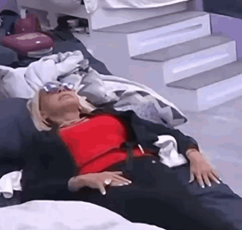Woman Lying on Couch with Sunglasses