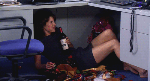 Woman Lying on Floor Holding California Wine Bottle