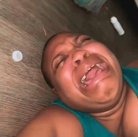 Woman Lying on Floor Making Funny Face