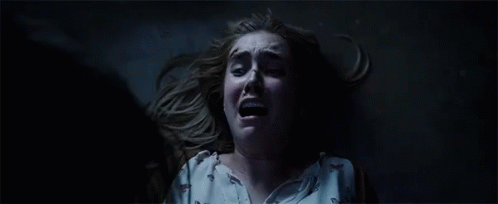 Woman Lying On Floor Mouth Open Dark GIF