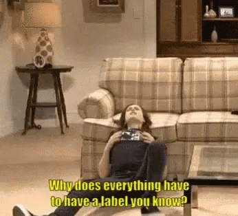 Woman Lying on Floor Saying Why Does Everything Have to Have a Label