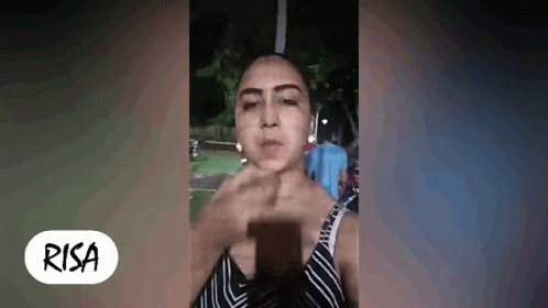 Woman Making Face Holding Cell Phone