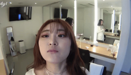 Woman Making Face in Mirror with LYJL