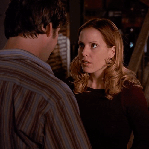 Woman Making Face Next to Man