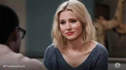 Woman Making Funny Face At Table With Man GIF