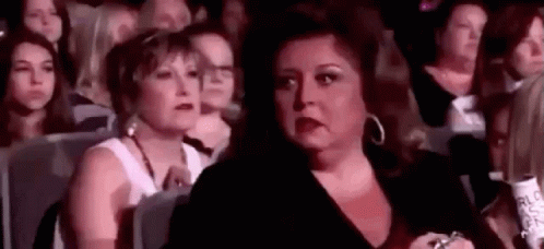 Woman Making Funny Face in Crowd