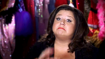 Woman Making Funny Face in Front of Closet