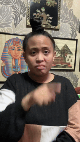Woman Making Funny Face in Front of Pyramid