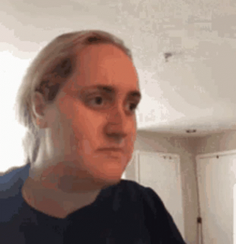 Woman Making Funny Face in Living Room