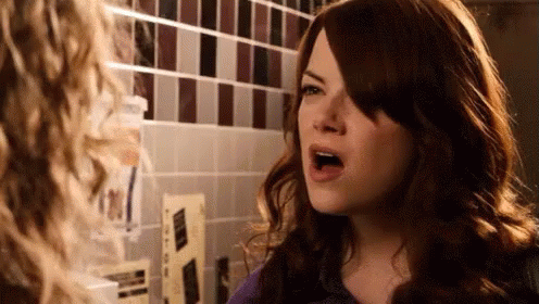 Woman Making Funny Face In Mirror GIF