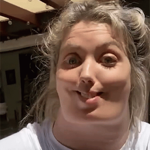 Woman Making Funny Face In White T-Shirt GIF