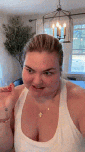 Woman Making Funny Face In White Tank Top GIF