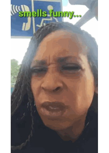 Woman Making Funny Face Near Parking Sign