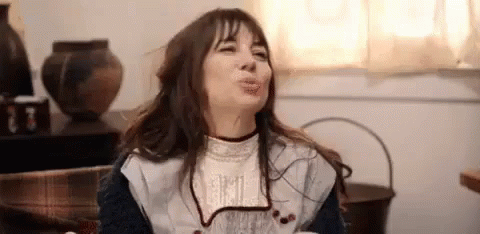 Woman Making Funny Face On Couch GIF