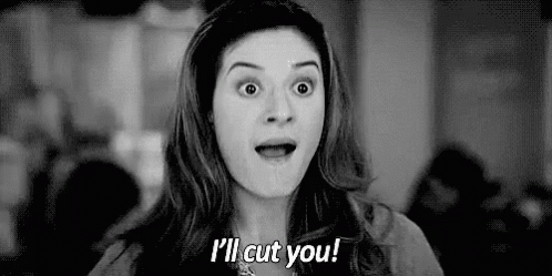 Woman Making Funny Face Saying I'll Cut You