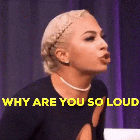 Woman Making Funny Face Saying Why Are You So Loud