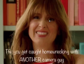 Woman Making Funny Face TFW You Get Caught Homewrecking With Another Camera Guy GIF
