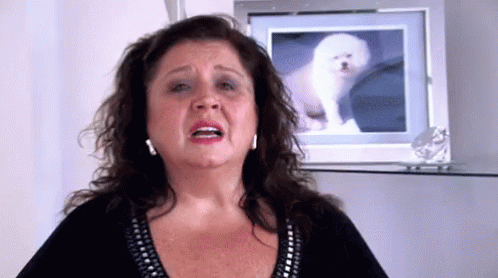 Woman Making Funny Face with Dog Picture
