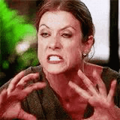 Woman Making Funny Face with Hands in Air
