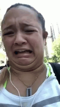 Woman Making Funny Face with Headphones