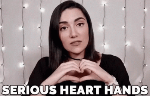 Woman Making Heart Shape Saying Serious Heart Hands