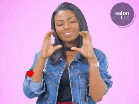 Woman Making Heart Shape with Hands