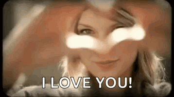 Woman Making Heart With Hands Saying I Love You