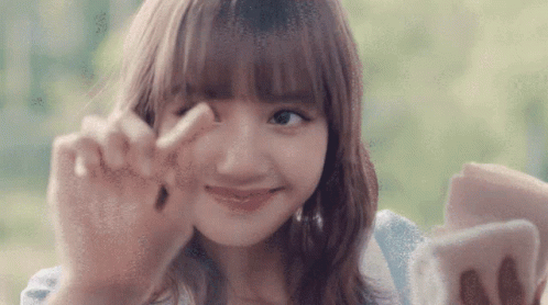 Woman Making Peace Sign GIF