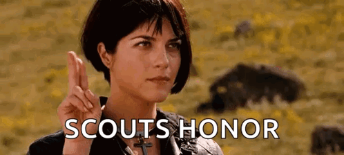 Woman Making Peace Sign Scouts Honor