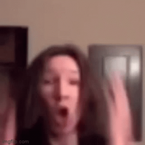 Woman Making Surprised Face with Hands Up