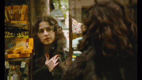 Woman Mirror Reflection with Yellow Visa Box