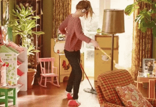 Woman Mopping Living Room Floor Listening To Music GIF