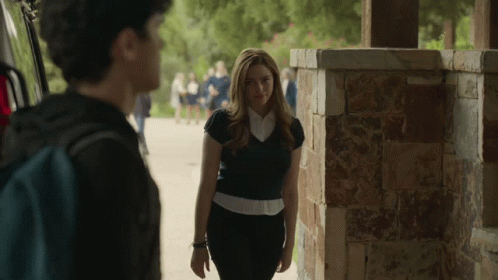 Woman Next To Man With Backpack GIF