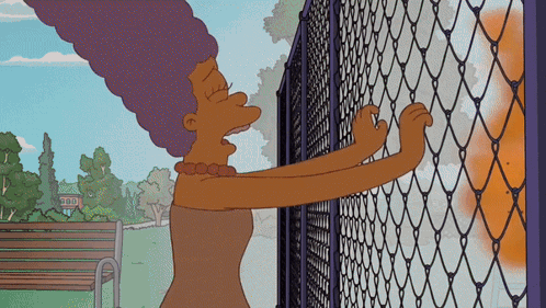 Woman Next to TNT Chain Link Fence