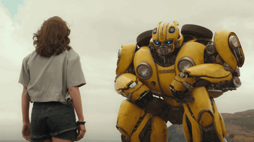 Woman Next to Yellow Robot Saying Bumblebee