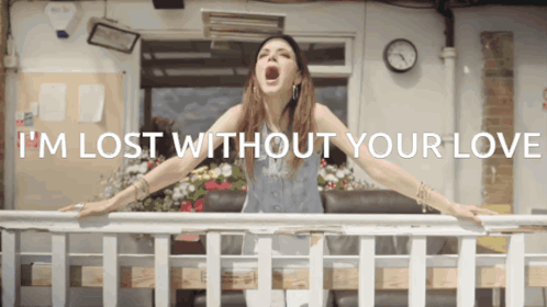 Woman On Balcony With I'm Lost Without Your Love GIF