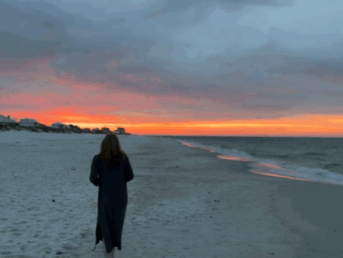 Woman on Beach Watching Sunset