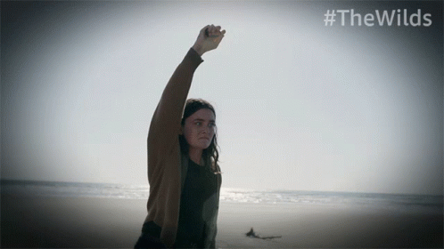 Woman on Beach With Fist in Air #thewilds