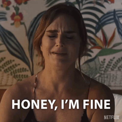 Woman on Bed Eyes Closed Saying Honey I'm Fine
