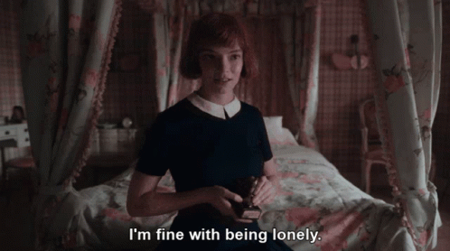Woman On Bed Saying I'm Fine With Being Lonely GIF