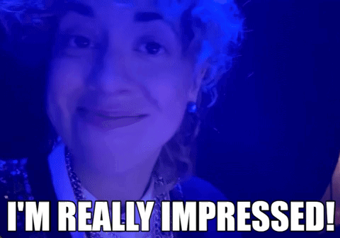 Woman on Blue Background Saying I'm Really Impressed